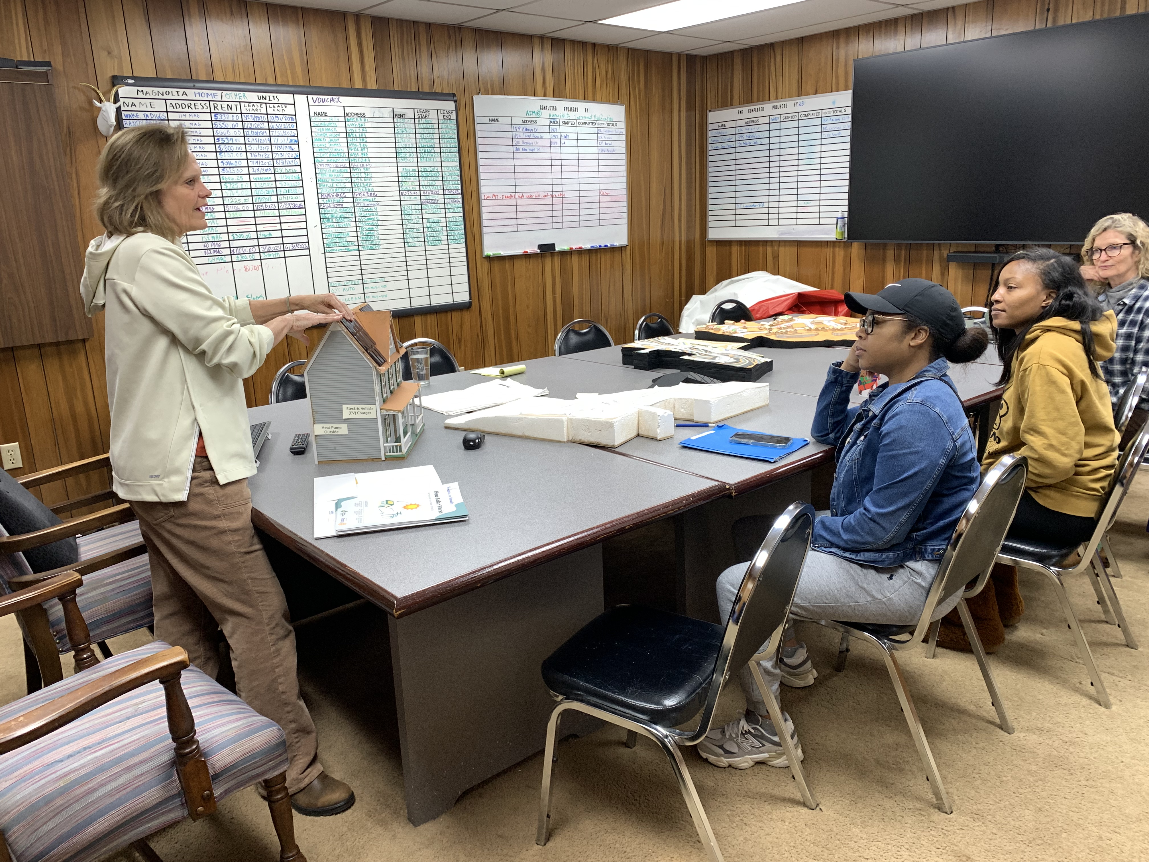 Energy education workshop with residents and a model home